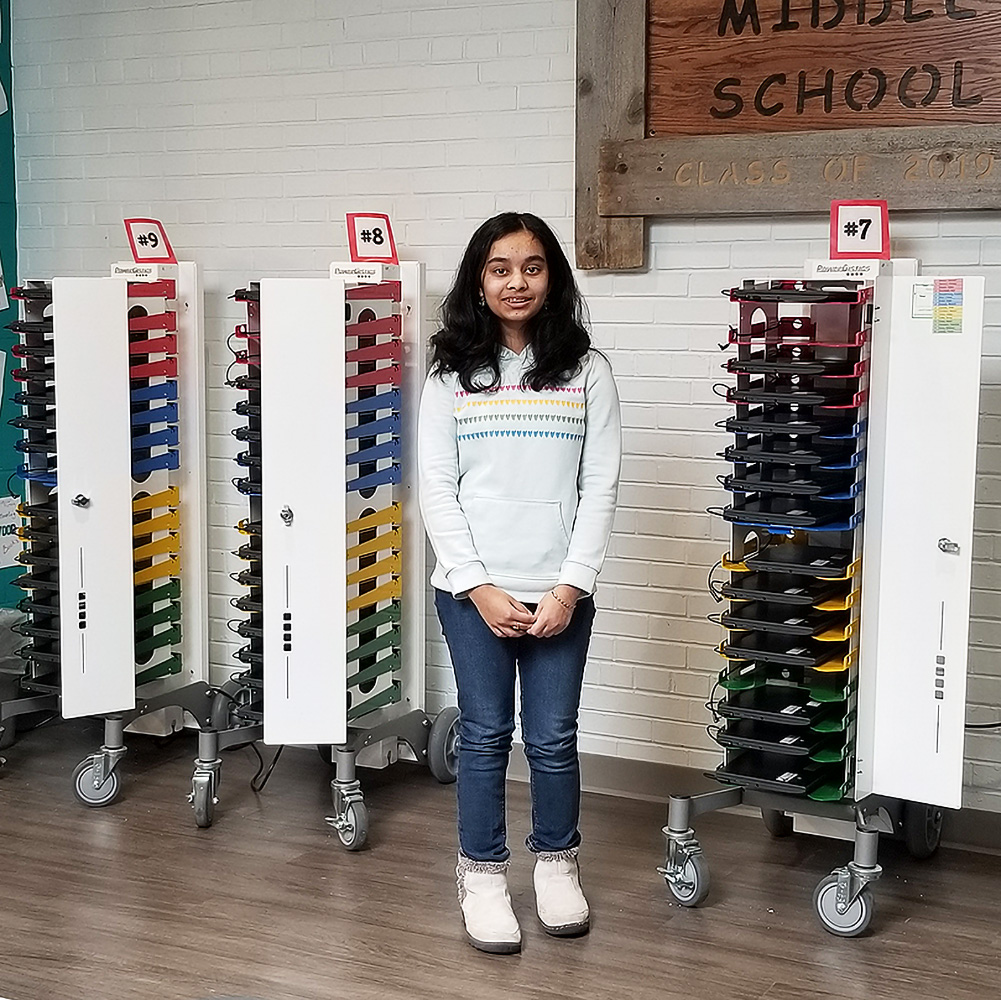 PowerGistics Core16 charging stations with girl standing in front